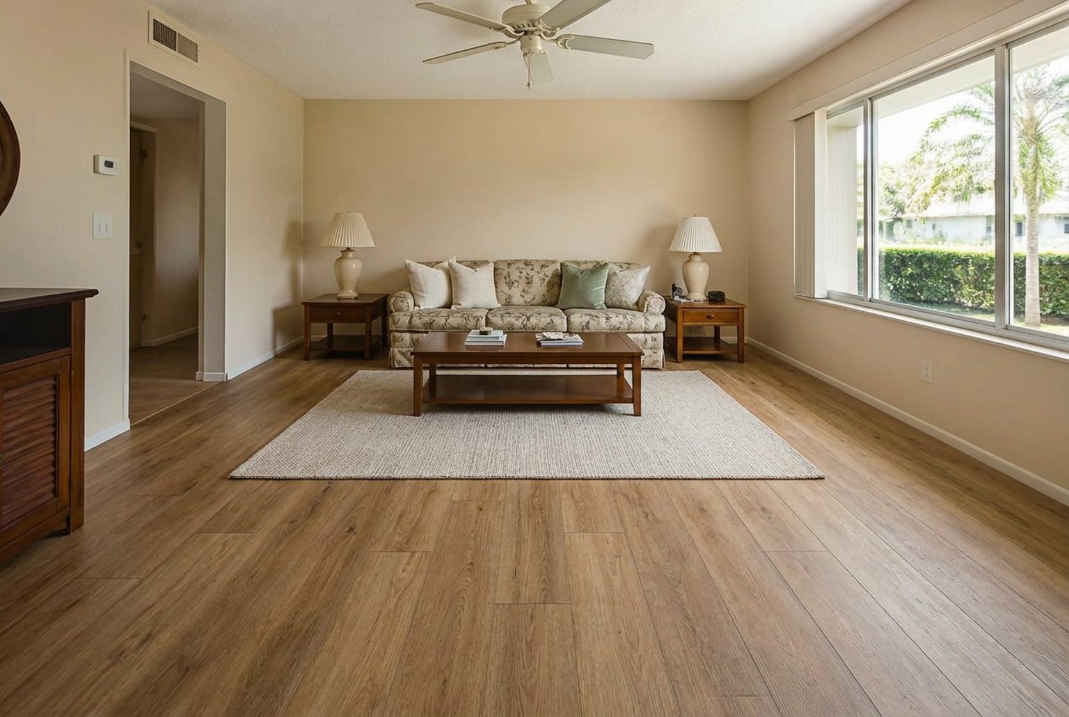 Same living room after waterproof luxury vinyl plank flooring installation
